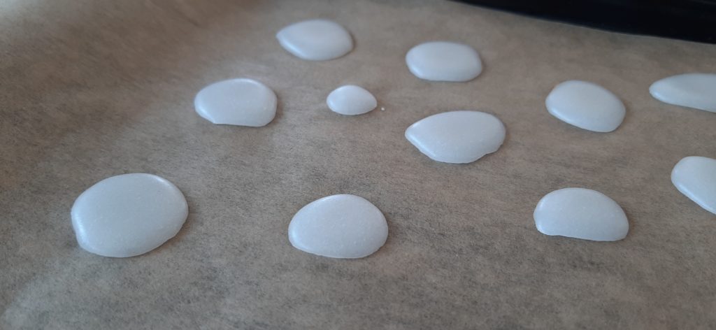Mint pastilles on baking paper